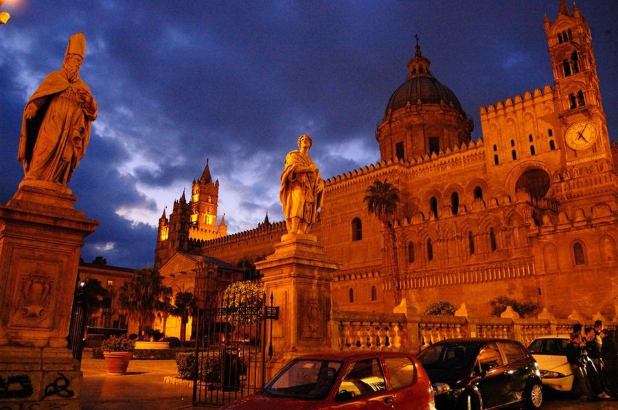Palermo Cathedral and statues at dusk