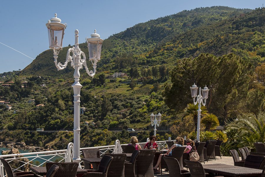 Terrace tables overlooking the coast of Sicily