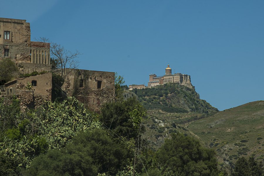 Historic complex on a hill amid green slopes in Sicily